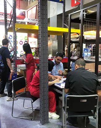 Exhibition team presenting high density storage solutions